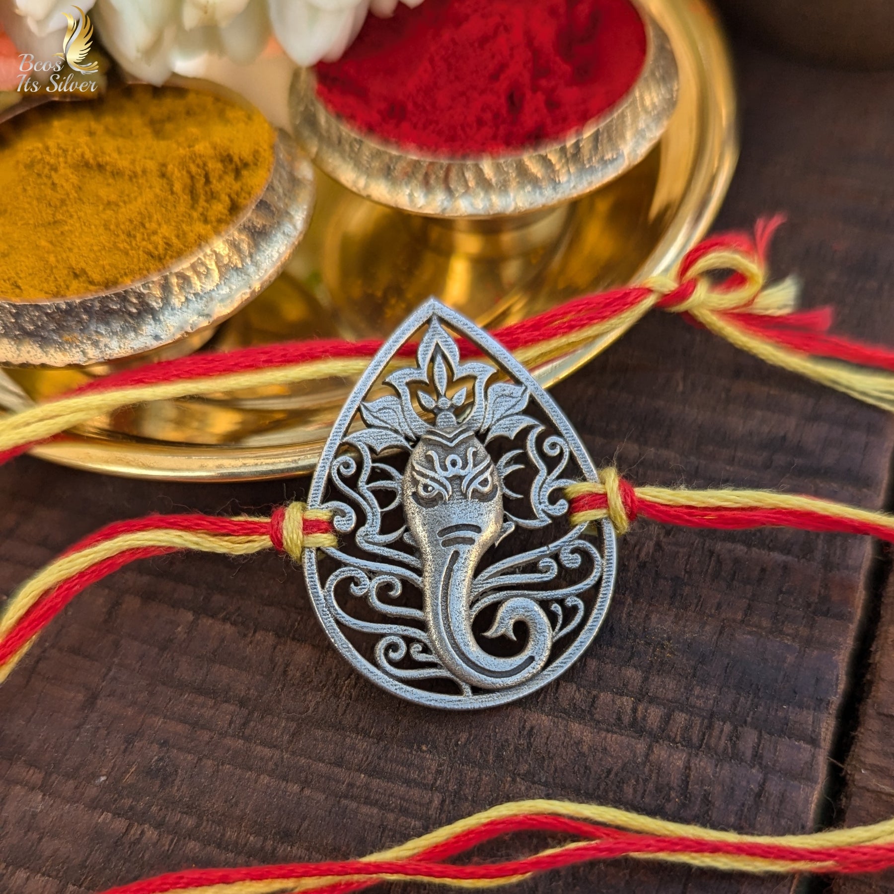 Lord Ganesha on leaf Rakhi - 4103